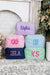 A group of a extra large nylon pouches are customized with embroidered monograms and names