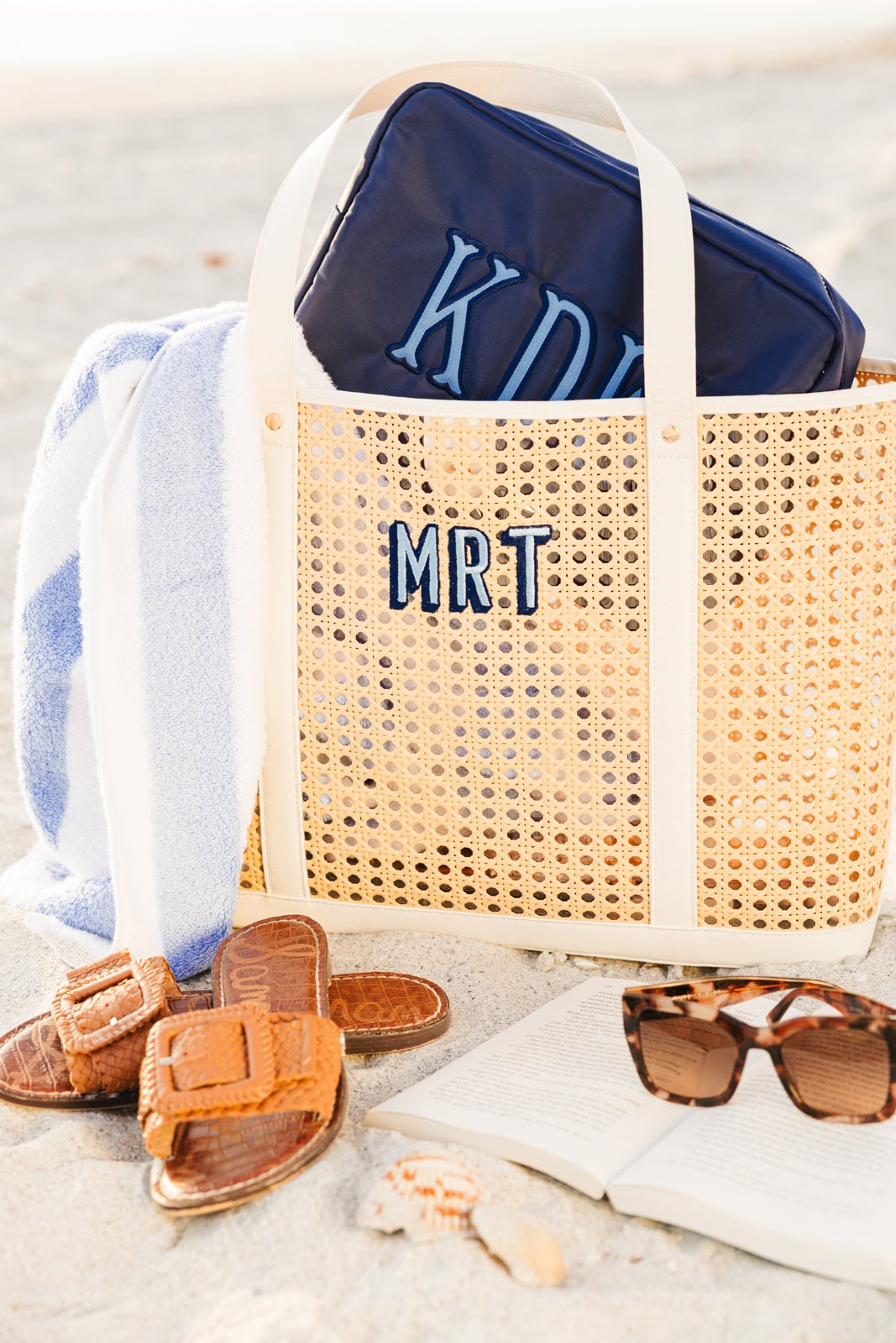 A canning tote is customized with a navy blue monogram