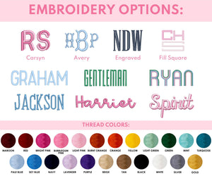 Embroidery options displayed with various monogram styles, including Carsyn, Avery, Engraved, Fill Square, Graham, Gentleman, Ryan, Jackson, Harriet, and Spirit. Below the embroidery options, a selection of thread colors is shown, including Maroon, Red, Bright Pink, Bubblegum Pink, Light Pink, Burnt Orange, Orange, Yellow, Light Green, Green, Mint, Turquoise, Pale Blue, Sky Blue, Navy, Lavender, Purple, Beige, Tan, Black, White, Silver, and Gold, with the text 'Embroidery Options' at the top.