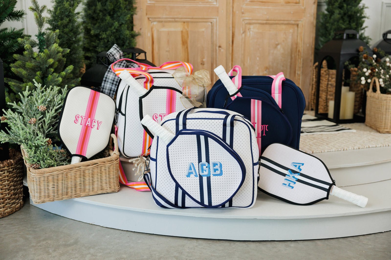 A navy and white pickleball bag is customized with a blue monogram.