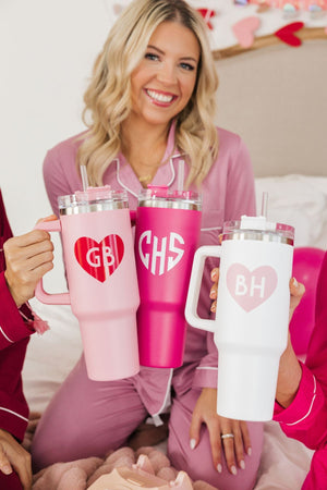 A group of girls hold their customized Valentine's Day tumblers