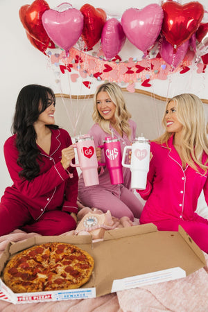 A group of girls hold their customized Valentine's Day tumblers