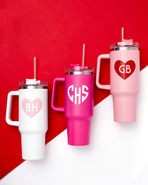 40 oz tumblers are customized with monogrammed Valentine's Day designs