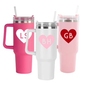 Drink tumblers customized with a monogrammed heart design