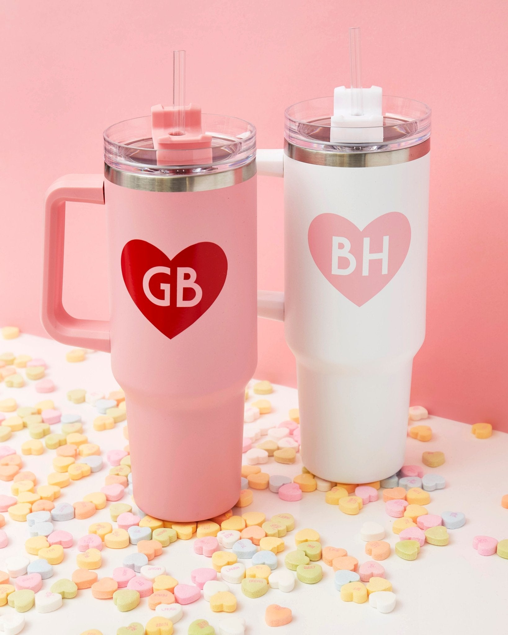 Drink tumblers customized with a monogrammed heart design