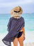 Three women cheers their champagne flutes while wearing customized black ribbon floppy beach hats