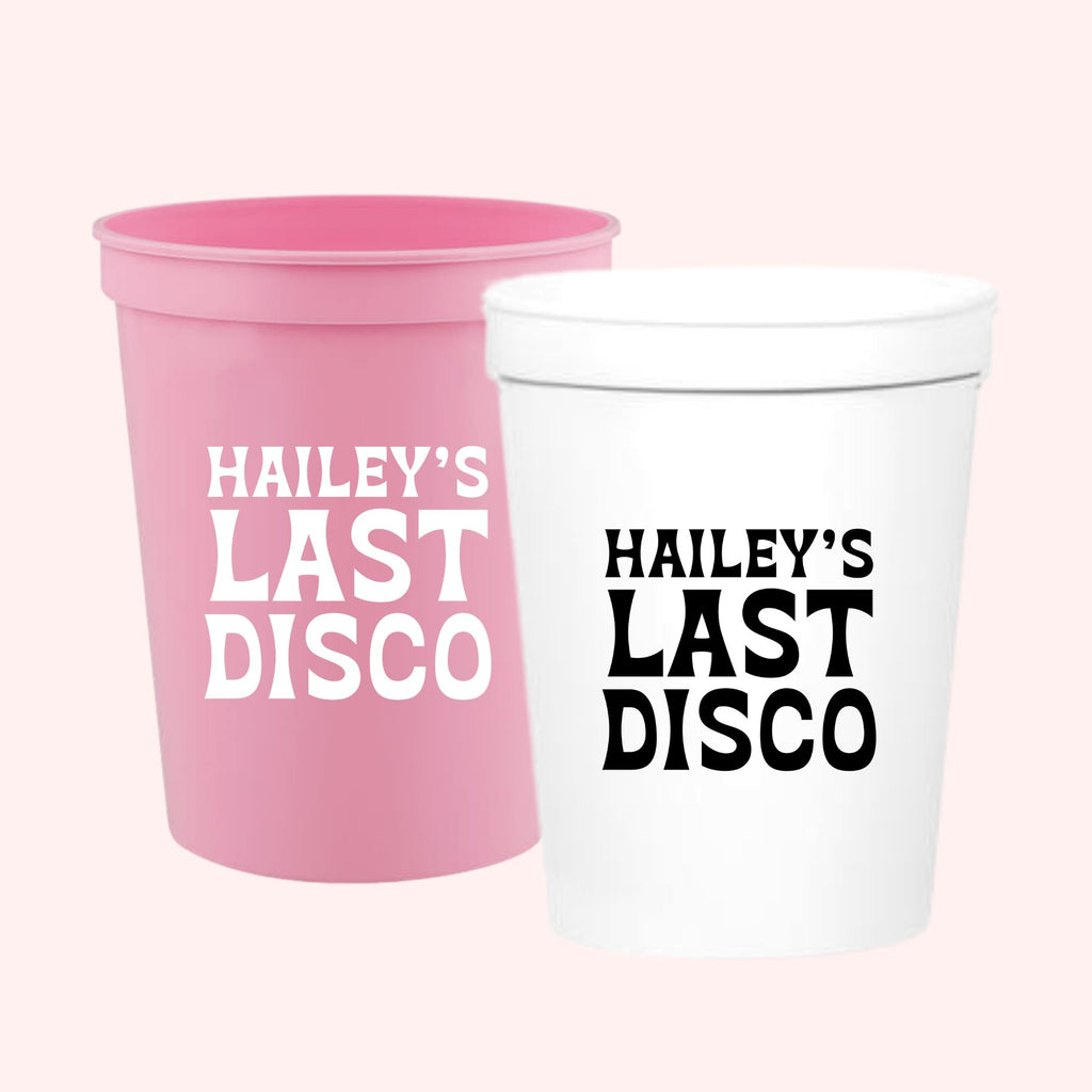 Pink and white stadium cups read 