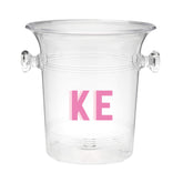 A clear ice bucket with "KE" monogrammed on the front in pink