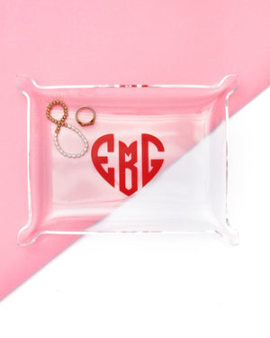 A personalized acrylic tray holds jewelry