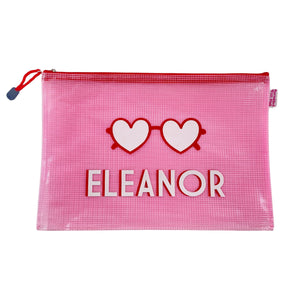 A pink pouch featuring heart sunglasses and customized with a name.